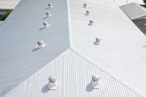 Aerial view of of roof coatings on a home.